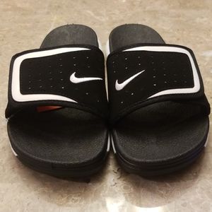 Black and white Nike slides